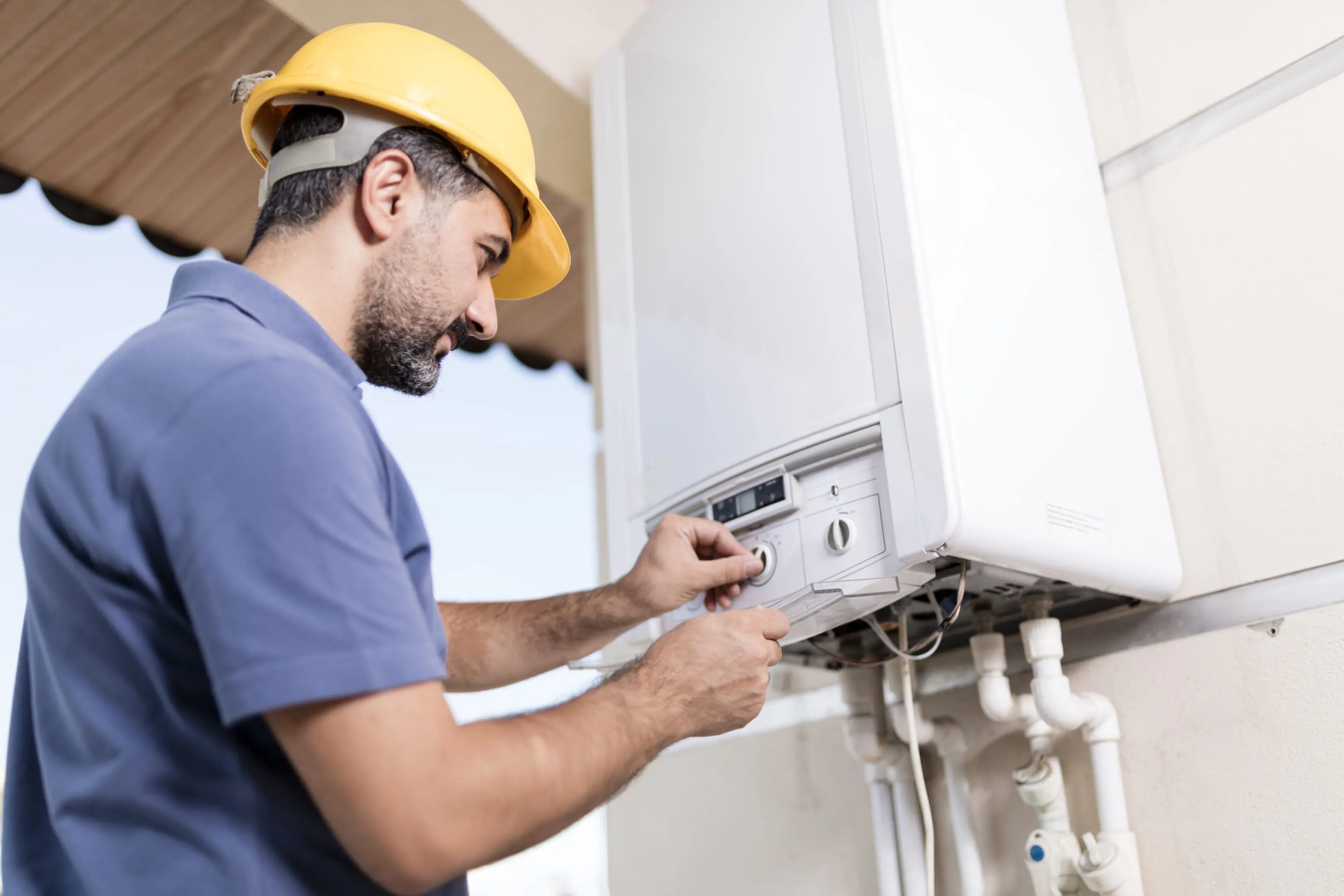 Technician inspecting a home boiler system.