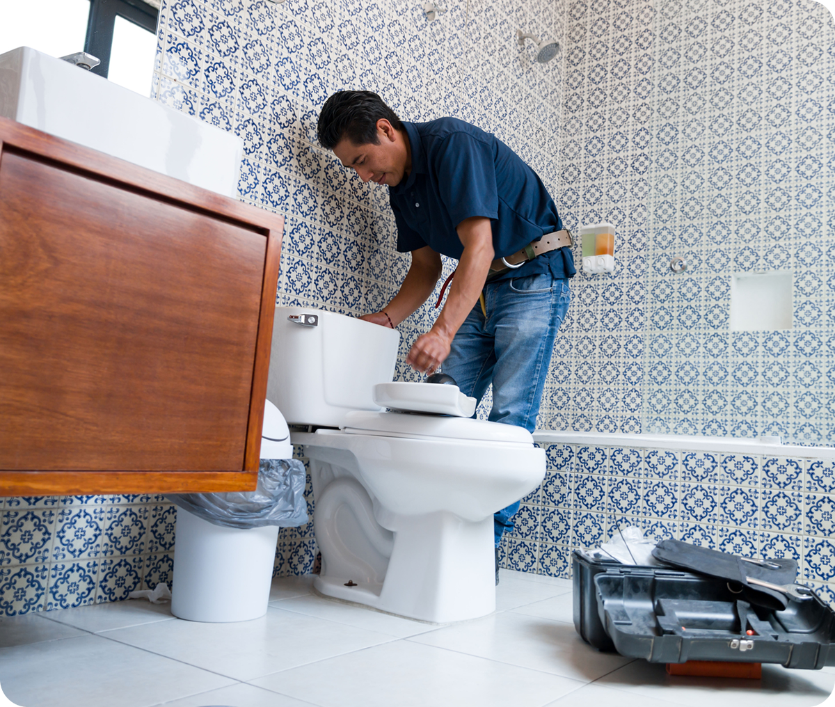 Technician working on toilet repair