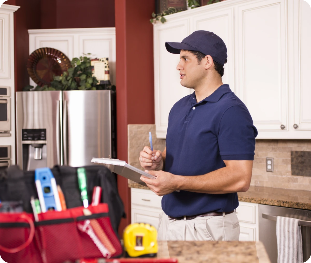 Worker with clipboard in kitchen